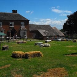 The Lawn at Huntlands Farm with bails to sit on at wedding party