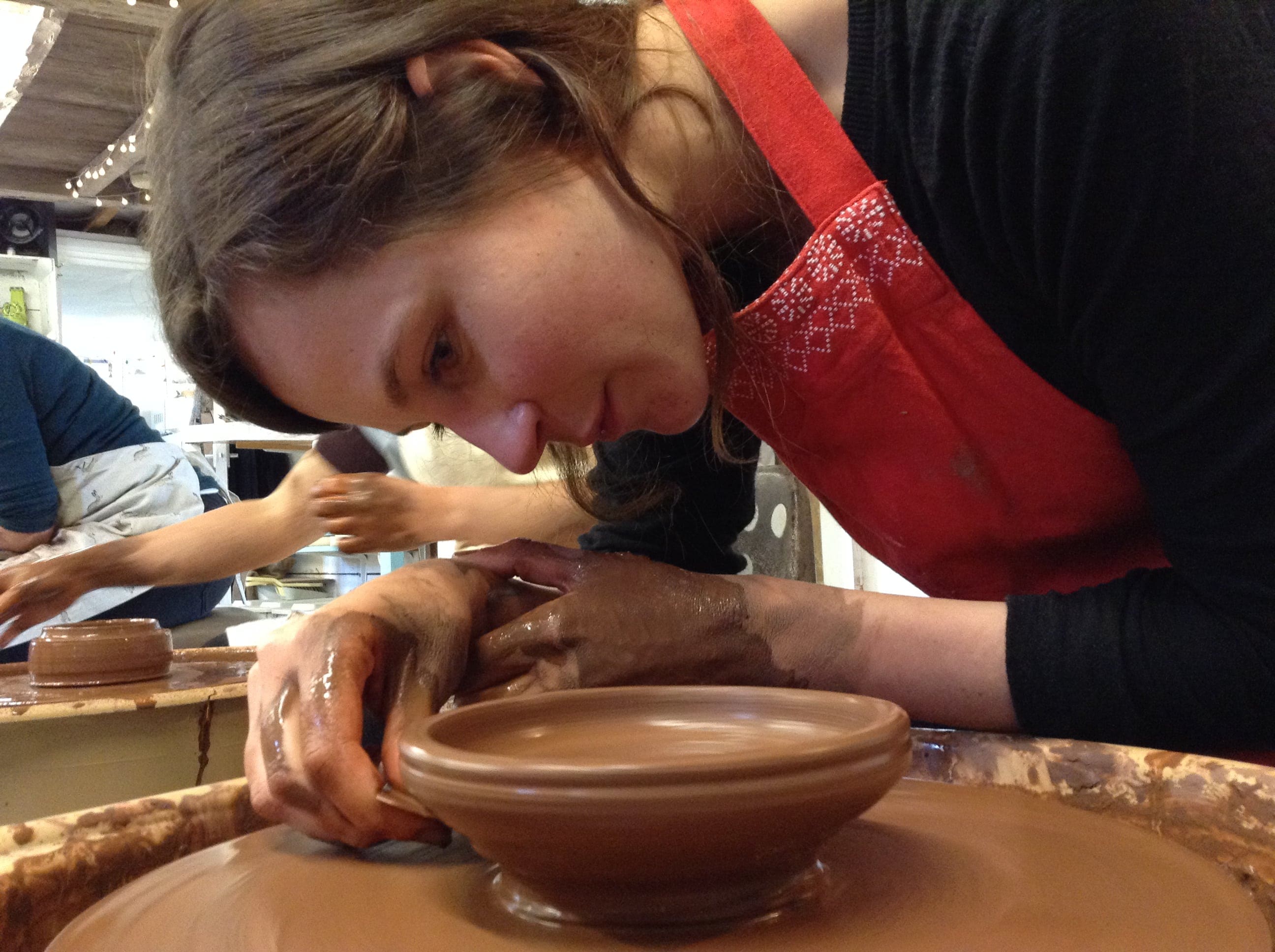 A lady creating some pottery Potter's Wheel Weekend Course