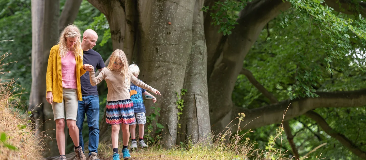 a family exploring the grounds of the weir garden herefordshire 1644956