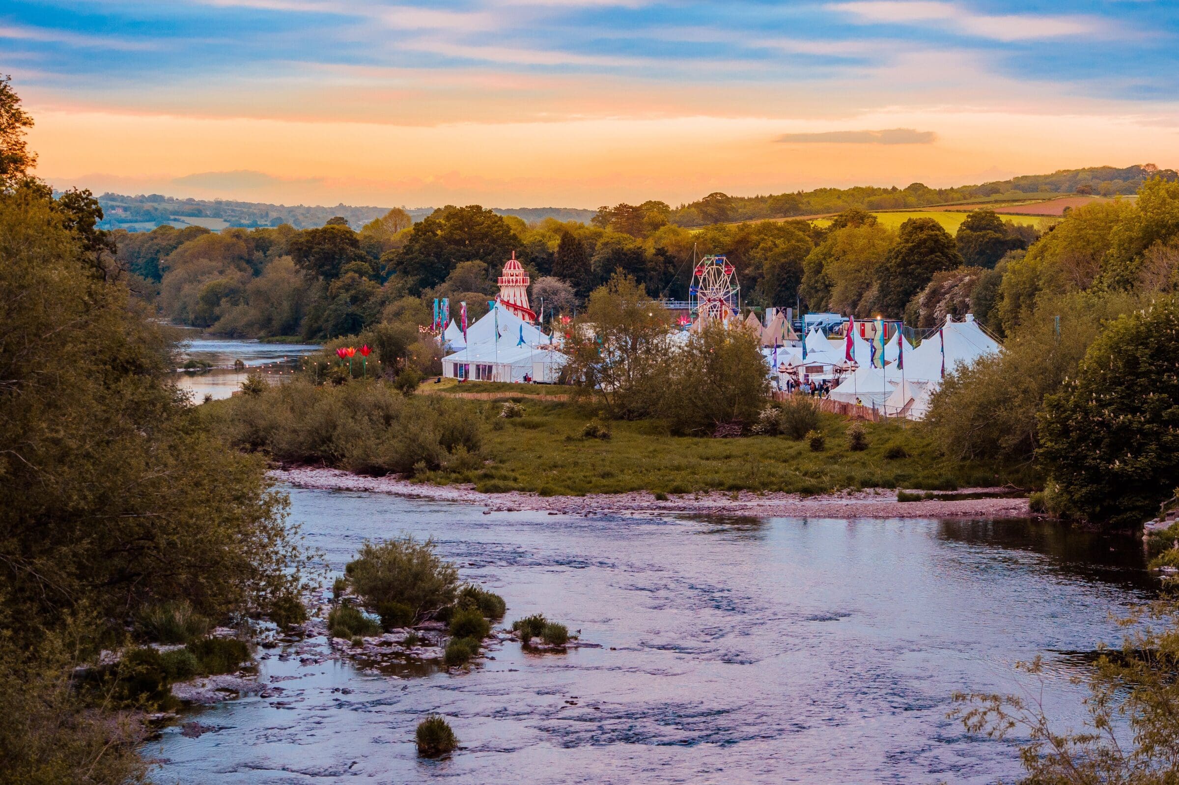 festival grounds with river
